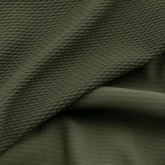 Olive green stretch solid bullet textured knitted fabric for garment